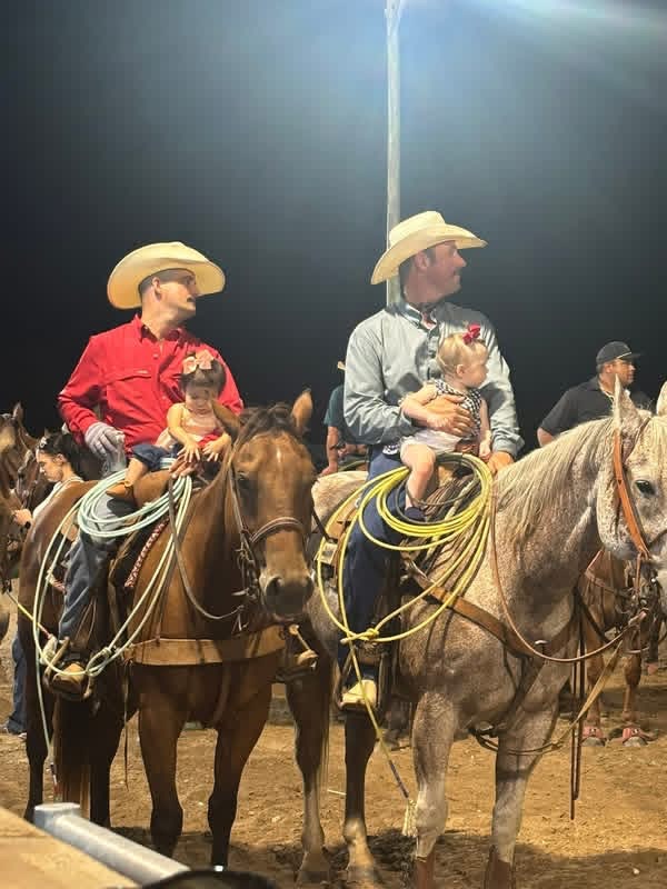 Team roping at the 7J Ranch arena in Bay City, Texas